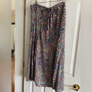 Tribal skirt   fabric sewn in on the sides to make the skirt look like a wrap